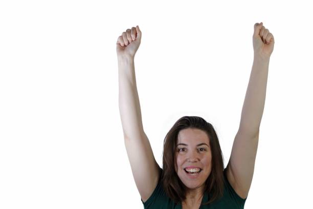 istock young long-haired brunette girl with her arms raised smiling 1453107876