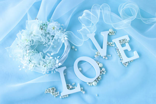 character of "LOVE" and Whiet flowers bouquet character of "LOVE" and Whiet flowers bouquet blue dress stock pictures, royalty-free photos & images