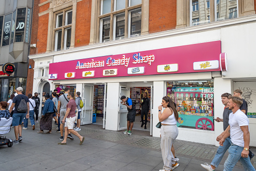People outside American Candy Shop on Oxford Street in City of Westminster, London