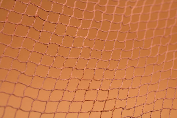 istock Brown fishing net, on soft brown background 1453114071
