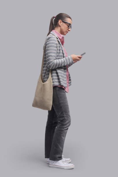 istock Young woman chatting with her smartphone 1453116273