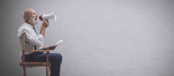istock Film director shouting with a megaphone 1453116343
