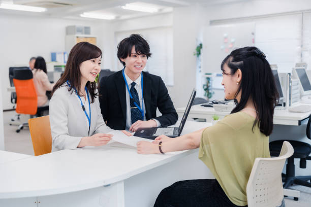 istock Business people working happily in the office 1453120044