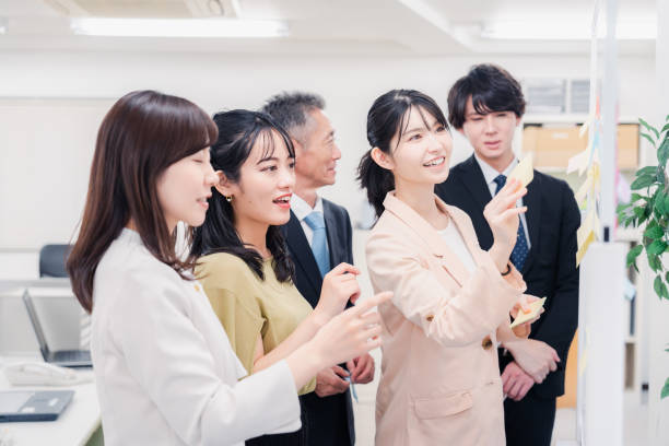 istock Business people working happily in the office 1453120083