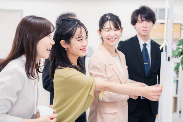 istock Business people working happily in the office 1453120088