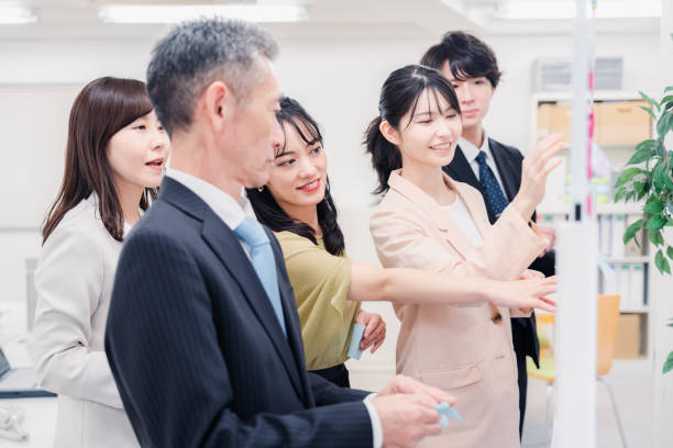 istock Business people working happily in the office 1453120089