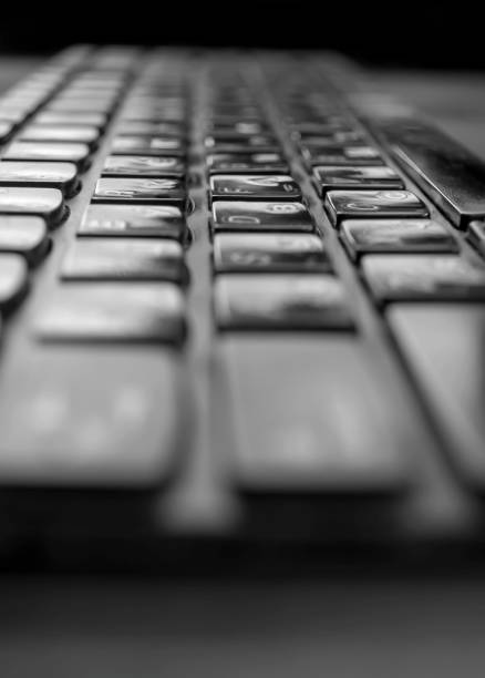 Computer keyboard up close. Vertical photo of laptop keyboard.