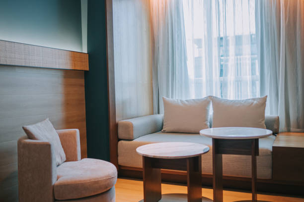 istock Modern Hotel Room Chaise Longue , Sofa and coffee table beside window 1453121630