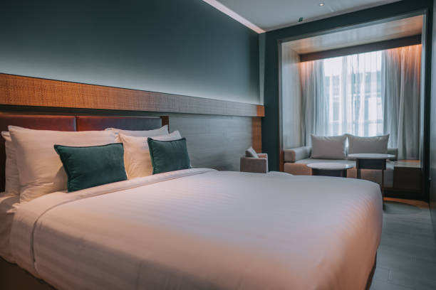 istock Modern Hotel Room With Double Bed, Night Tables and day sofa bed 1453121633
