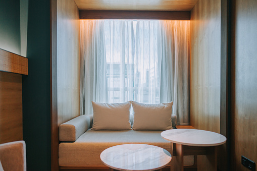 Modern Hotel Room Chaise Longue , Sofa and coffee table beside window