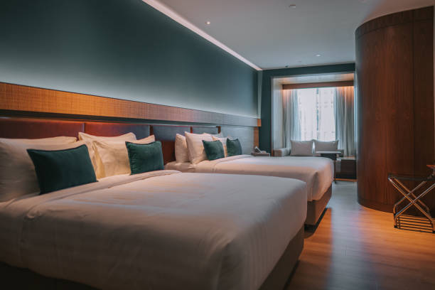 istock Modern Hotel Room With Double Bed, Night Tables and day sofa bed 1453121641