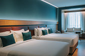 Modern Hotel Room With Double Bed, Night Tables and day sofa bed