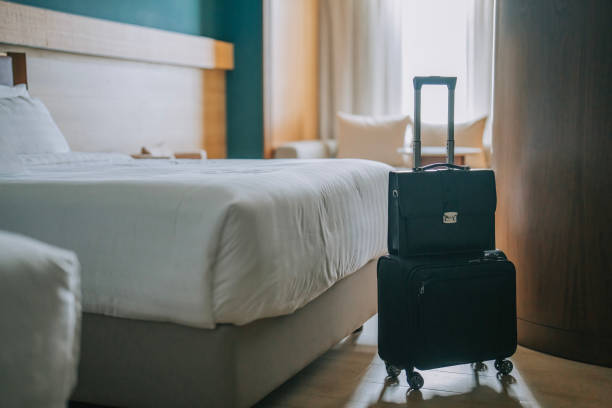 istock Modern Hotel Room With Bed, Night Tables and suitcase luggage 1453122711