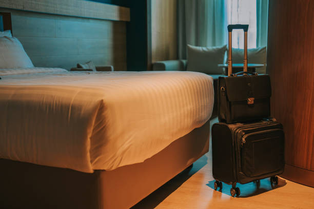 istock Modern Hotel Room With Bed, Night Tables and suitcase luggage 1453122713