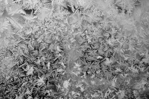 background of Ice fractals on frozen glass.