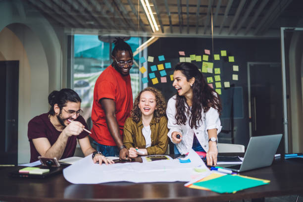 istock Positive creative business team working with paper draft 1453128305