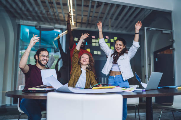 istock Happy workers enjoying success of project 1453128324