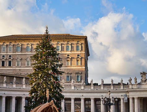 Vatican Rome, Italy - December 28, 2022 Apostolic Palace facade with Christmas tree.