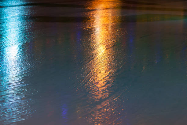 Ice rink texture with colorful reflections, abstract skating background photo
