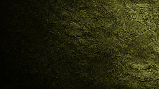 Olive green stone texture. Olive color. Gradient. Dark light shade. Toned background with space for design. Rough grainy cracked surface.