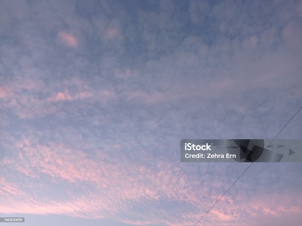 relaxing cloud background Scattered relaxing cloudscape in dusty pink-Light Blue tones Backgrounds Stock Photo