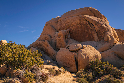 Joshua Tree National Park Hiking Trail Landscape Series, rugged rock formations, red boulders stacked up in abstract shapes of the geological pile in Southern California, USA