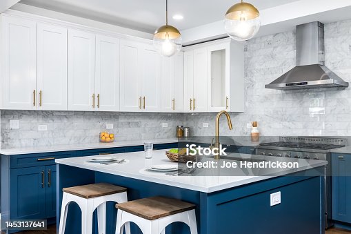 istock A blue and white kitchen with gold accents. 1453137641