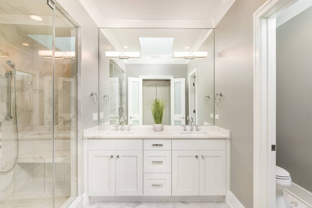 istock A modern bathroom with a white cabinet and marble tiled shower. 1453138274