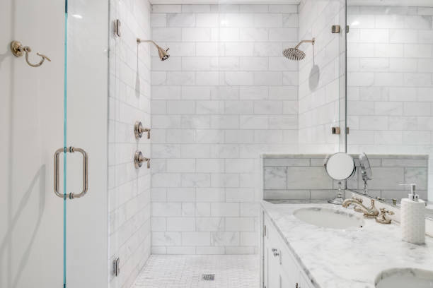 istock A white bathroom with a marble subway tile shower. 1453138321