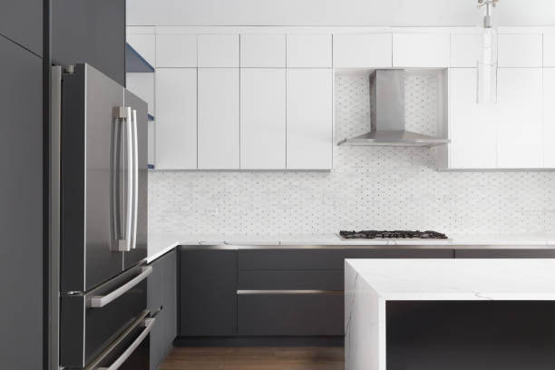 istock A kitchen detail shot with white and grey cabinets and a tiled backsplash. 1453138865