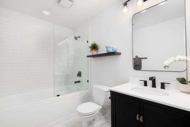 istock A white bathroom with a dark vanity and subway tile shower. 1453138917