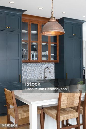 istock A kitchen detail with blue cabinets and white island. 1453138926