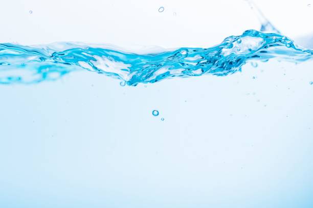 istock Surface of the blue water waves splash on a white background 1453138954