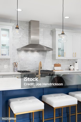 istock A modern kitchen with blue and white cabinets. 1453138966