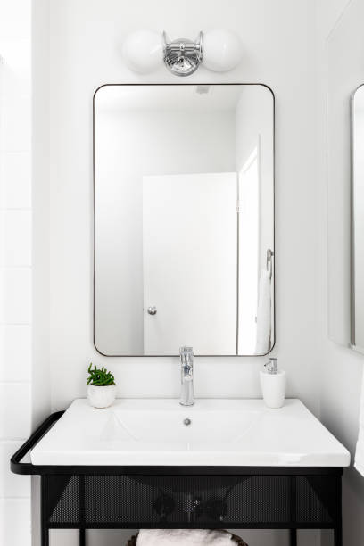istock A bathroom with a metal vanity and white sink. 1453138999