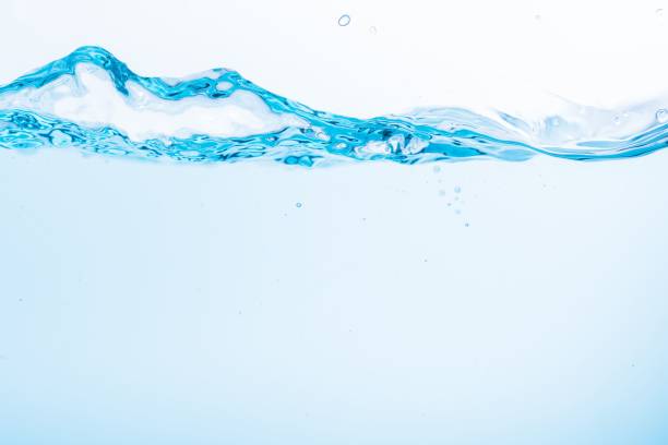 istock Surface of the blue water waves splash on a white background 1453139075