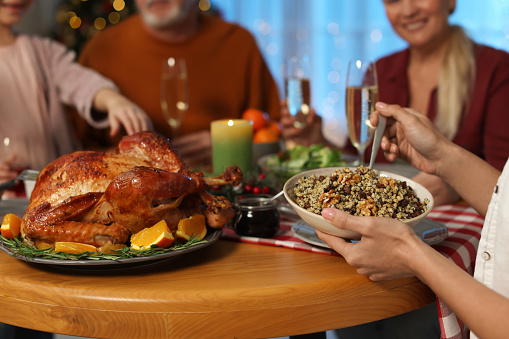https://media.istockphoto.com/id/1453140305/photo/woman-with-bowl-of-traditional-christmas-slavic-dish-kutia-and-her-family-at-festive-dinner.jpg?b=1&s=170667a&w=0&k=20&c=UmUsk274X5TQe7fr4KMtudCqvevwLmncw_X8WQtyFcc=