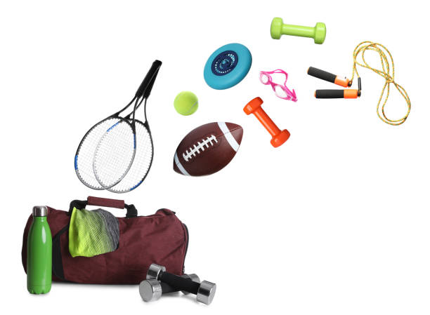 istock Sports bag and different gym stuff flying on white background 1453140874