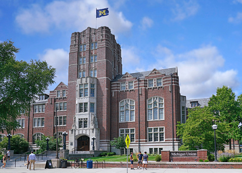 Ann Arbor, Michigan - August 2022: University of Michigan Union building, constructed 1917, a student center, with flag on top