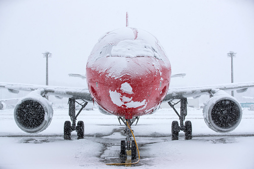 Aircraft covered with snow during a heavy a snow storm