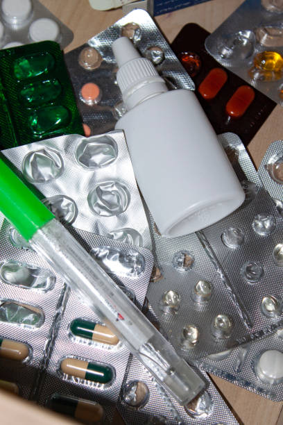 istock medicines in a box with a thermometer, tablets, vitamins, pills and a cold spray 1453143949