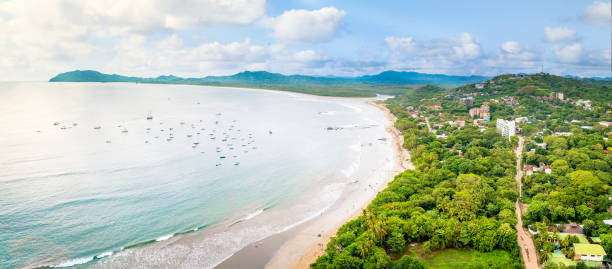 tamarindo beach and estuary, guanacaste, costa rica - tamarindo foto e immagini stock