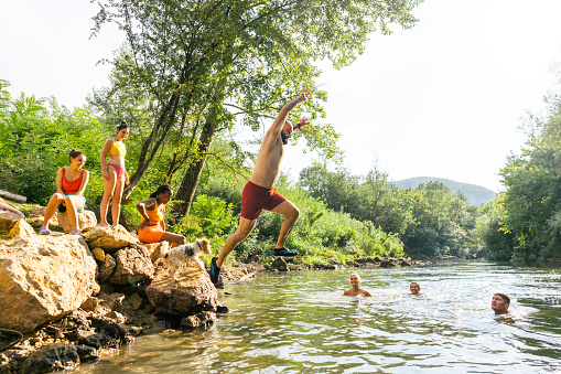istock Jumping into the river 1453146365