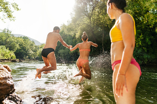 Photo of friends spending a day on the river