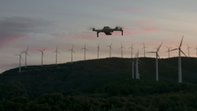 Drone hovering in the air at dusk