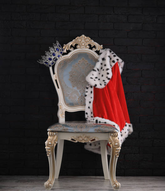istock vintage royal chair on black background 1453150759