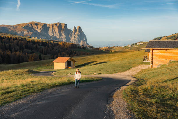 istock Woman walking on the background of Seiser Alm 1453152151