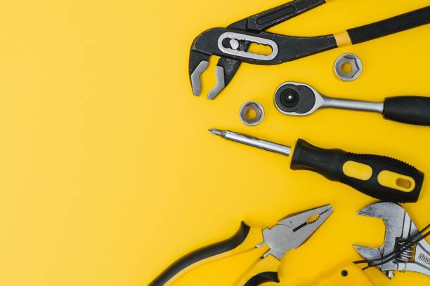 istock Set of various construction tools. Tools for home repair. Work at a construction site. On a yellow background. Flatly. Flatlay 1453154687