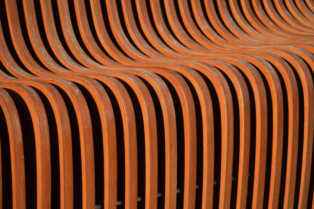 istock Curved wooden slats. Beautiful brown surface. Abstract background. 1453154812