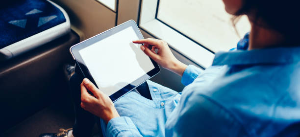 istock Selective focus on cropped travel woman using 4g wireless on palmtop technology with copy space area for internet advertising or touristic website, female blogger messaging with followers on touch pad 1453155962